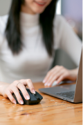 close-up-of-female-hands-using-mouse-and-laptop-co